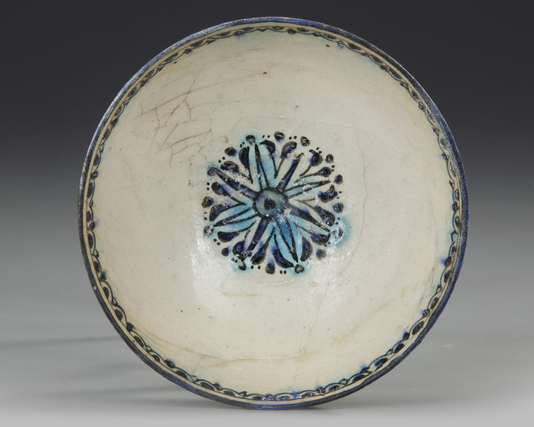 A KASHAN POTTERY BOWL, PERSIA, EARLY 13TH CENTURY