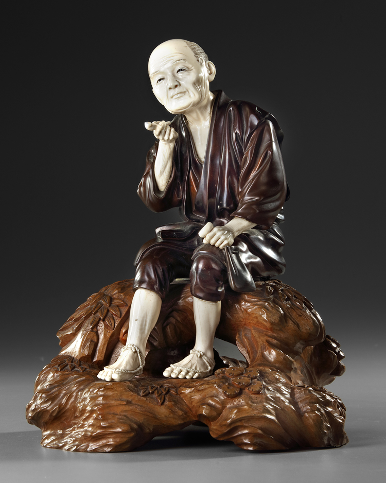 A LARGE JAPANESE BRONZE AND IVORY OKIMONO OF A PIPE SMOKER, MEIJI PERIOD (1868-1912)