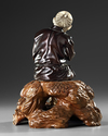 A LARGE JAPANESE BRONZE AND IVORY OKIMONO OF A PIPE SMOKER, MEIJI PERIOD (1868-1912)