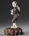 A JAPANESE BRONZE AND IVORY OKIMONO OF A PIPE SMOKER, MEIJI PERIOD (1868-1912)