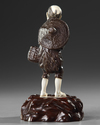 A JAPANESE BRONZE AND IVORY OKIMONO OF A PIPE SMOKER, MEIJI PERIOD (1868-1912)
