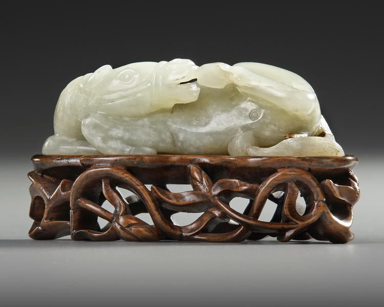 A CHINESE GRAYISH JADE CARVING OF A HORSE, 19TH CENTURY