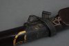 A BLACK LACQUERED QUIVER