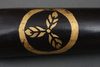 A BLACK LACQUERED QUIVER
