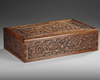 A COLLECTION OF CHINESE WHITE-GLAZED SCROLL WEIGHTS IN A CARVED WOODEN BOX