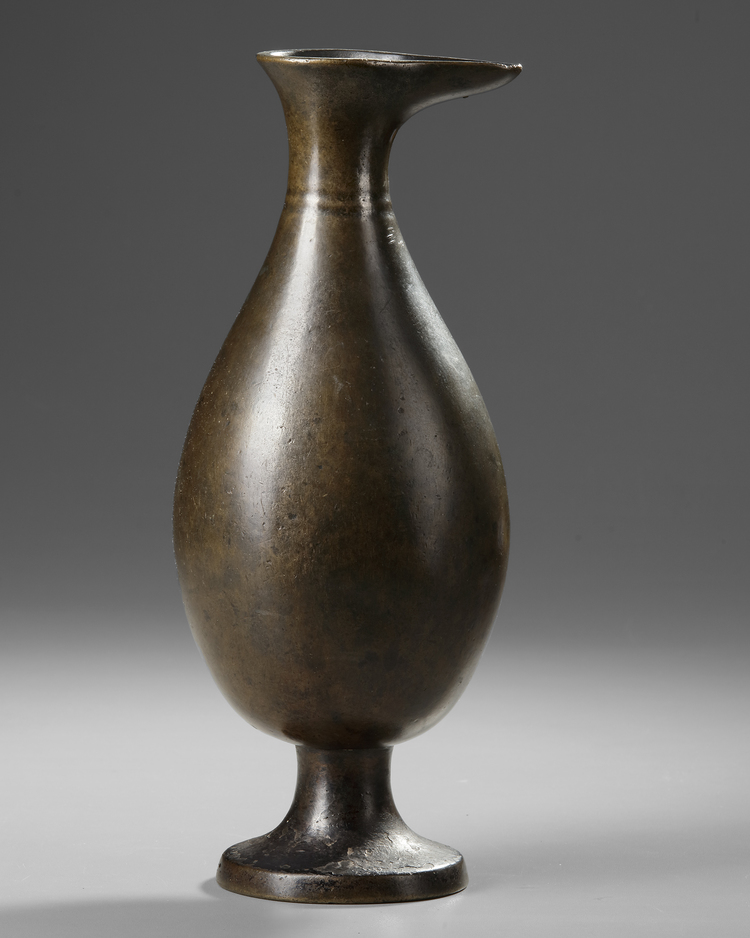 AN EARLY ISLAMIC BRONZE EWER, MESOPOTAMIA OR PERSIA, 8TH-9TH CENTURY