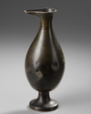 AN EARLY ISLAMIC BRONZE EWER, MESOPOTAMIA OR PERSIA, 8TH-9TH CENTURY