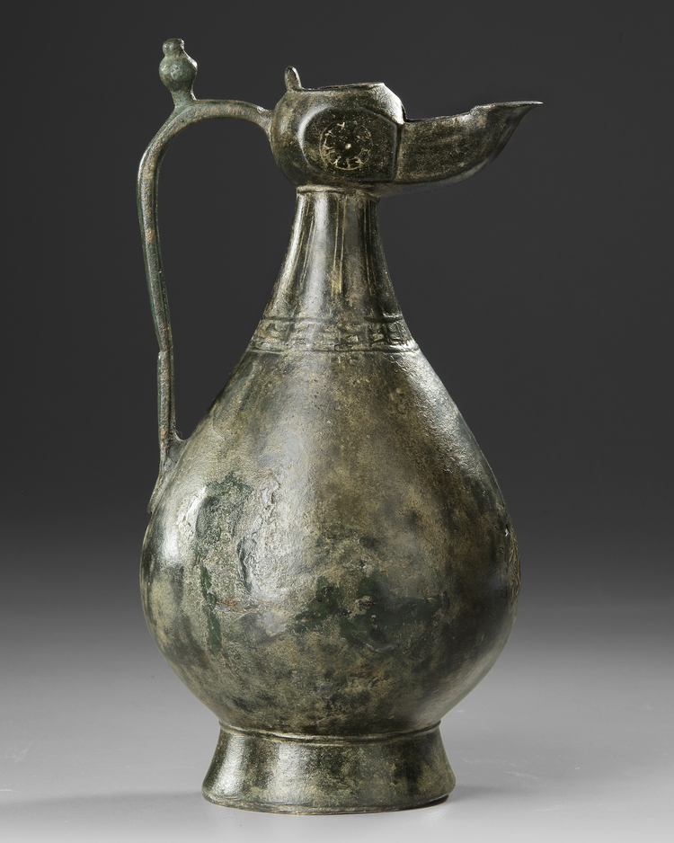 A SELJUK BRONZE OIL LAMP EWER, PERSIA, 12TH CENTURY