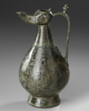 A SELJUK BRONZE OIL LAMP EWER, PERSIA, 12TH CENTURY