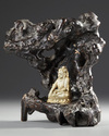 A CHINESE CARVED BONE FIGURE OF A BUDDHA WITH A CARVED WOODEN STAND