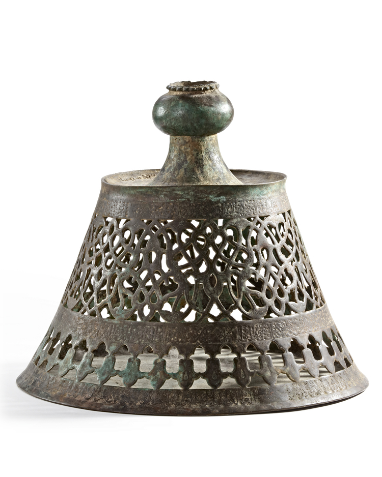 A  SELJUK BRONZE CANDLESTICK, KHURASSAN 12TH-13TH CENTURY