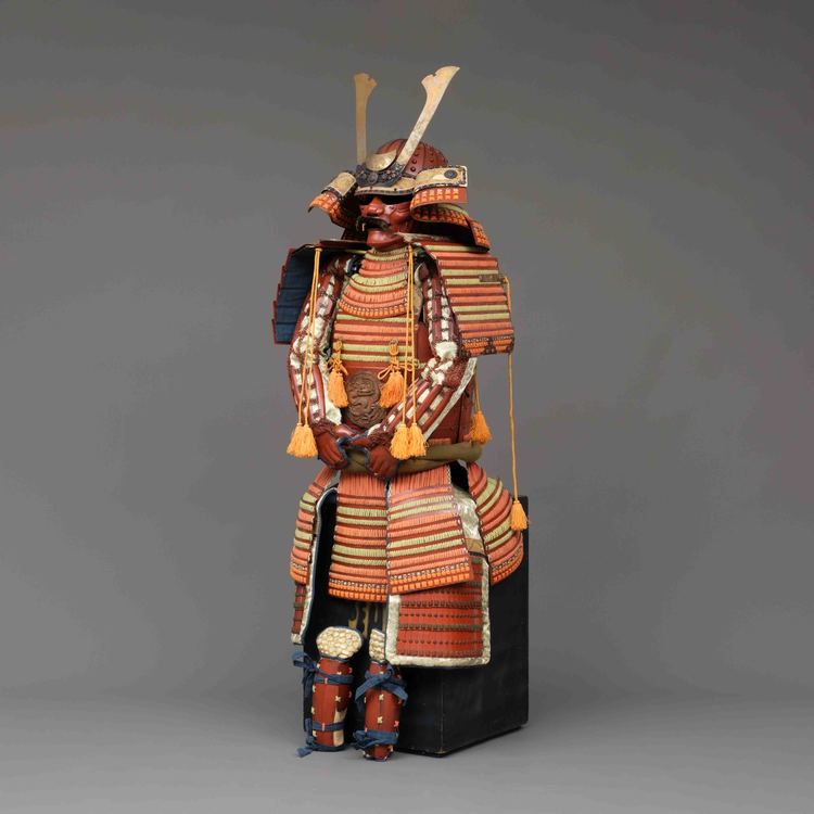 A RED LACQUER SUIT-OF-ARMOUR (YOROI), MID-SHOWA PERIOD