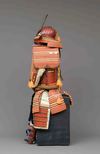 A RED LACQUER SUIT-OF-ARMOUR (YOROI), MID-SHOWA PERIOD