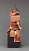 A RED LACQUER SUIT-OF-ARMOUR (YOROI), MID-SHOWA PERIOD