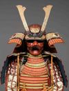 A RED LACQUER SUIT-OF-ARMOUR (YOROI), MID-SHOWA PERIOD