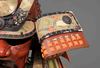 A RED LACQUER SUIT-OF-ARMOUR (YOROI), MID-SHOWA PERIOD