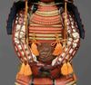 A RED LACQUER SUIT-OF-ARMOUR (YOROI), MID-SHOWA PERIOD