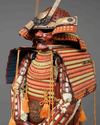 A RED LACQUER SUIT-OF-ARMOUR (YOROI), MID-SHOWA PERIOD