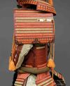 A RED LACQUER SUIT-OF-ARMOUR (YOROI), MID-SHOWA PERIOD