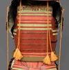 A RED LACQUER SUIT-OF-ARMOUR (YOROI), MID-SHOWA PERIOD