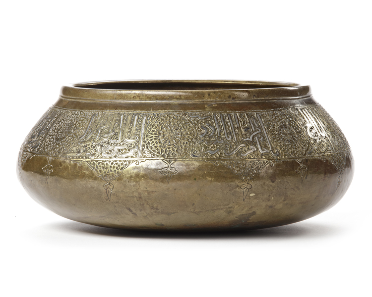 A SILVER-INLAID BRASS BOWL, FARS PERSIA, 14TH CENTURY