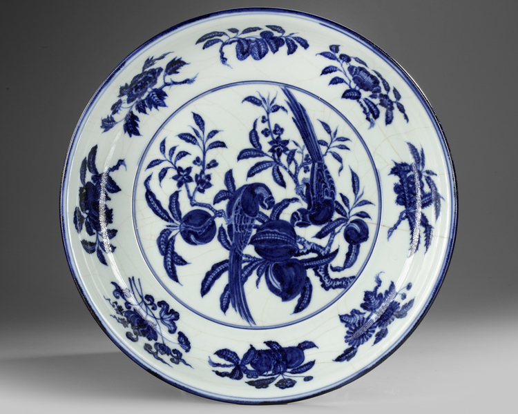 A CHINESE BLUE AND WHITE 'BIRDS' CHARGER, QING DYNASTY (1644–1911)