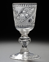 AN 18TH CENTURY CRYSTAL ENGRAVED DRINKING GLASS OR CHALICE