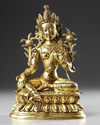 A GILT-BRONZE FIGURE OF GREEN TARA QING DYNASTY, 18TH CENTURY