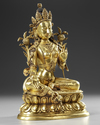 A GILT-BRONZE FIGURE OF GREEN TARA QING DYNASTY, 18TH CENTURY