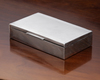 A RECTANGULAR SILVER BOX, 20TH CENTURY