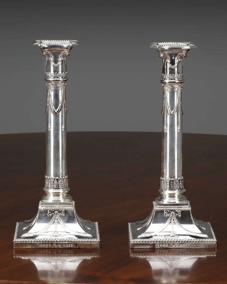 A PAIR OF DUTCH SILVER NEOCLASSICAL CANDLESTICKS, 1908 & 1911