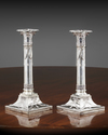 A PAIR OF DUTCH SILVER NEOCLASSICAL CANDLESTICKS, 1908 & 1911