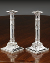 A PAIR OF DUTCH SILVER NEOCLASSICAL CANDLESTICKS, 1908 & 1911