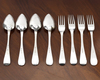 FOUR DUTCH SILVER DINNER FORKS AND FOUR SILVER DINNER SPOONS, (8 PIECES), (1886/1887)