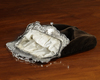 AN ART NOUVEAU SILVER PURSE BRACKET WITH BLACK VELVET TEXTILE PURSE, CIRCA 1920