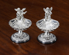 A PAIR OF SILVER SALTS SHAPED AS ANGELS MAKING MUSIC SEATED ON A SHELL (2)