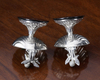 A PAIR OF SILVER SALTS SHAPED AS ANGELS MAKING MUSIC SEATED ON A SHELL (2)