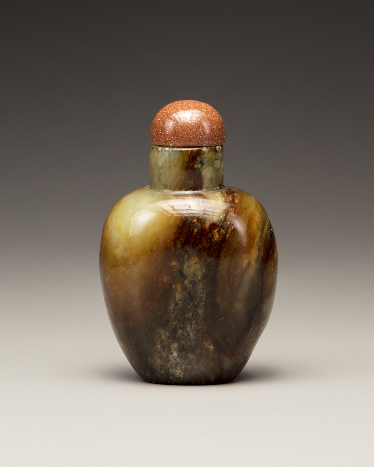 A celadon and russet jade snuff bottle
