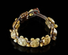 A CHINESE JADE CARVED TURTLES BRACELET, 20TH CENTURY