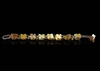 A CHINESE JADE CARVED TURTLES BRACELET, 20TH CENTURY