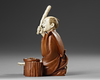 A JAPANESE WOOD AND BONE CARVED OKIMONO, MEIJI PERIOD (1868-1912)