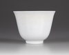 A SMALL CHINESE WHITE-GLAZED DRAGON AND PHOENIX CUP, 20TH CENTURY