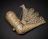 AN INDIAN BRASS GUNPOWDER FLASK, 18TH CENTURY