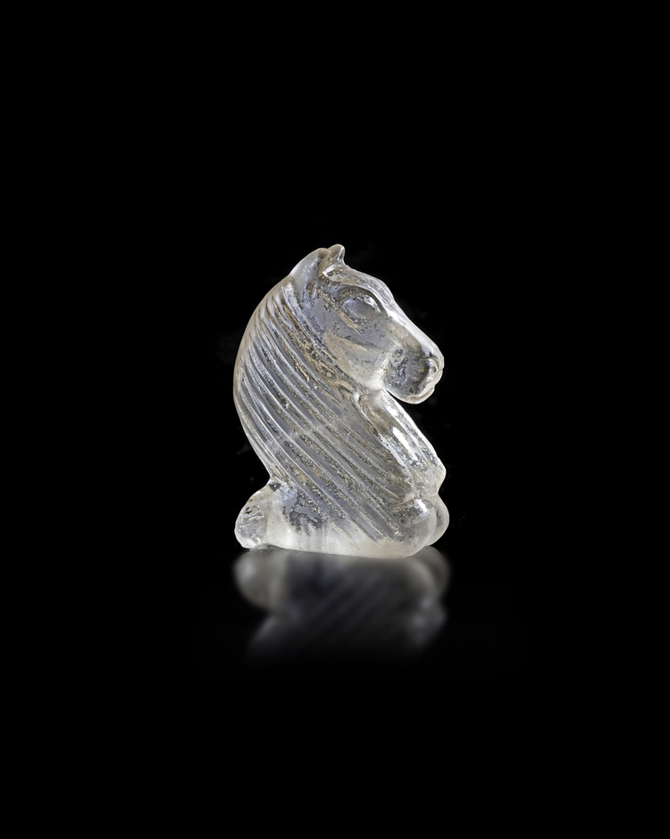 AN ISLAMIC CARVED ROCK CRYSTAL CHESS PIECE, 10TH-12TH CENTURY