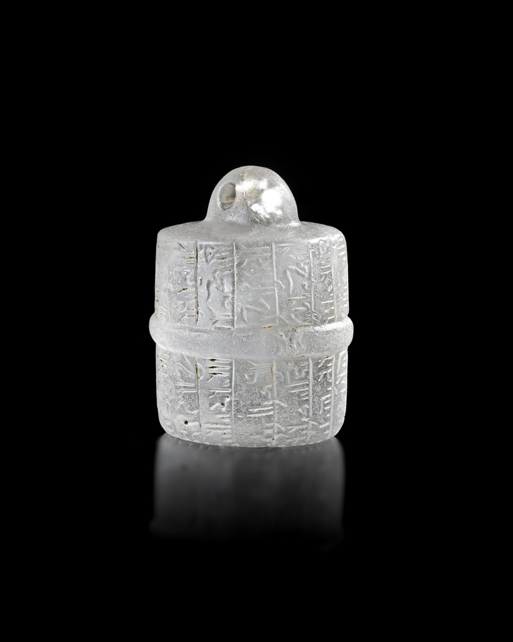 AN ISLAMIC CARVED CRYSTAL AMULET WITH KUFIC INSCRIPTIONS, 10TH-12TH CENTURY