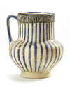A KASHAN POTTERY JUG, PERSIA,  11TH-12TH CENTURY