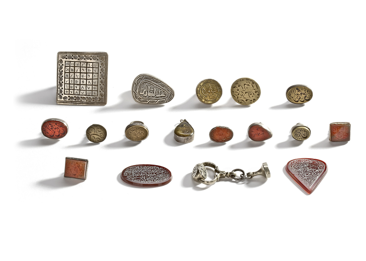 17 CARNELIAN AND SILVER SEALS WITH TEXT AND DATA, 19TH CENTURY