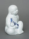 KAKIEMON’WARE PORCELAIN FIGURE OF A CHILD, SHOWA PERIOD (1926-1989)