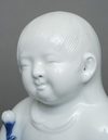 KAKIEMON’WARE PORCELAIN FIGURE OF A CHILD, SHOWA PERIOD (1926-1989)