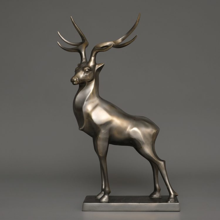 A JAPANESE LARGE BRONZE MUSCULAR STAG, TAISHO PERIOD (1912-1926)